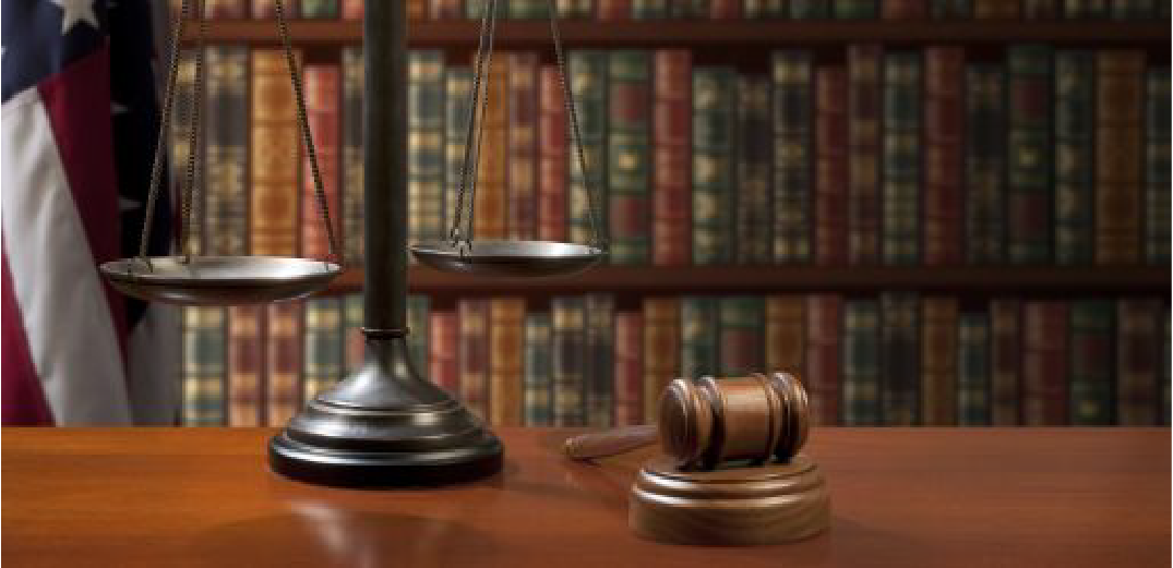 scales-of-justice-and-gavel-in-law-library