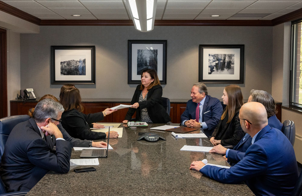 HCP Law lawyers meeting around conference table